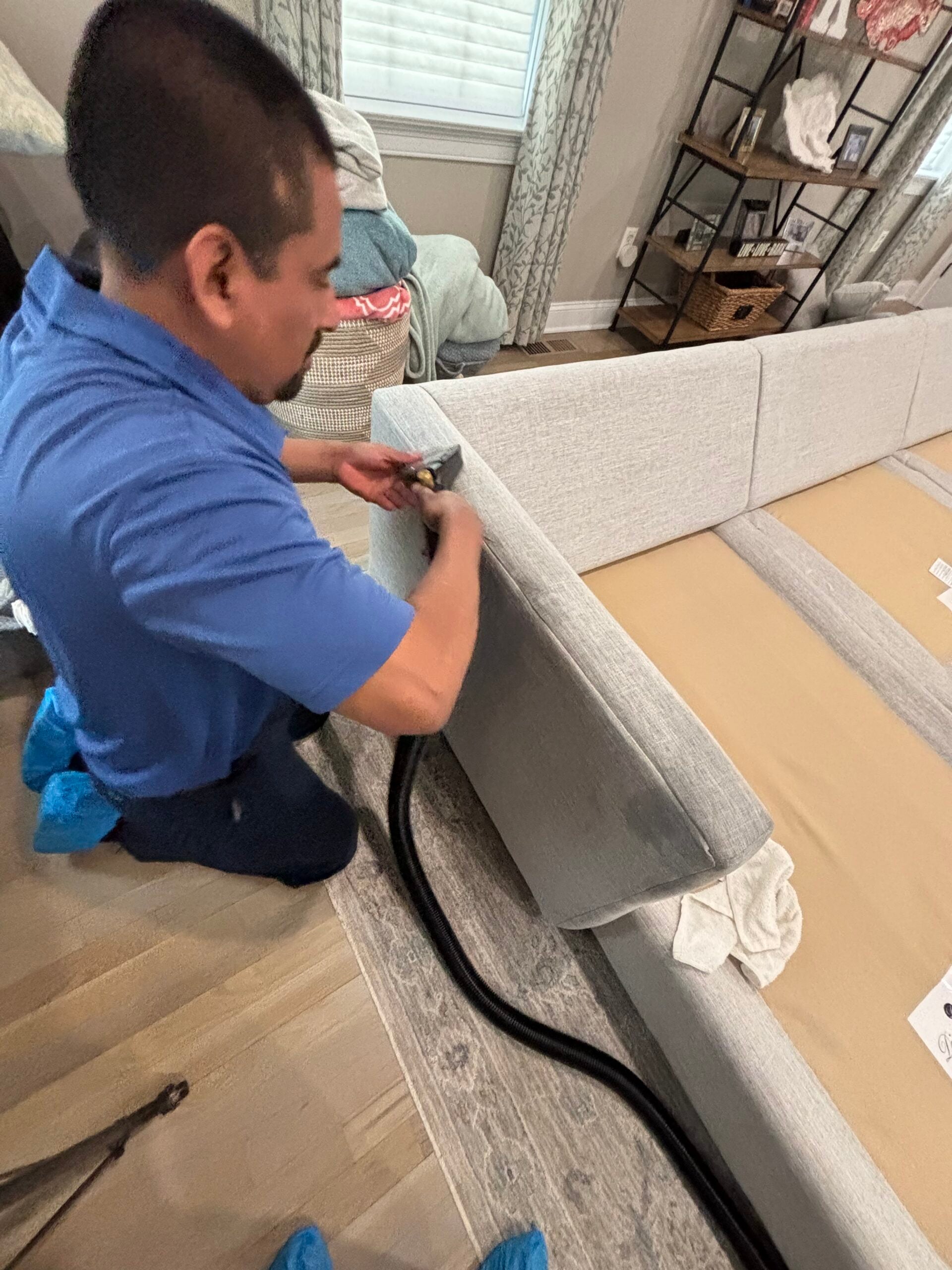 Technician deep cleaning a mattress in a Connecticut home
