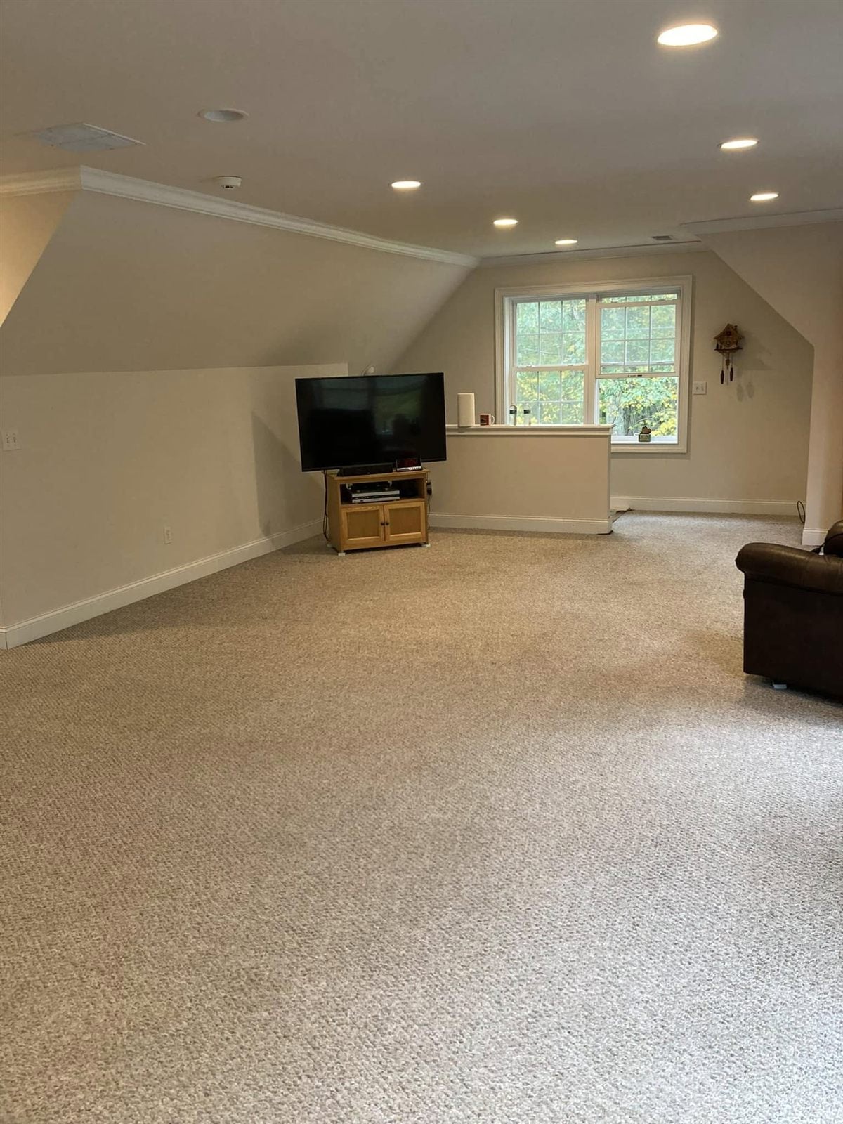 Clean carpet in a large finished attic room in a Shelton CT home