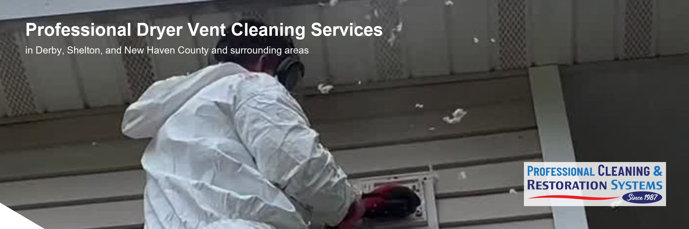 pcrs-dryer-vent-cleaning-banner Dryer vent cleaning in Derby CT — a PCRS technician on a ladder clearing an exterior wall vent, lint blowing clear of the hood