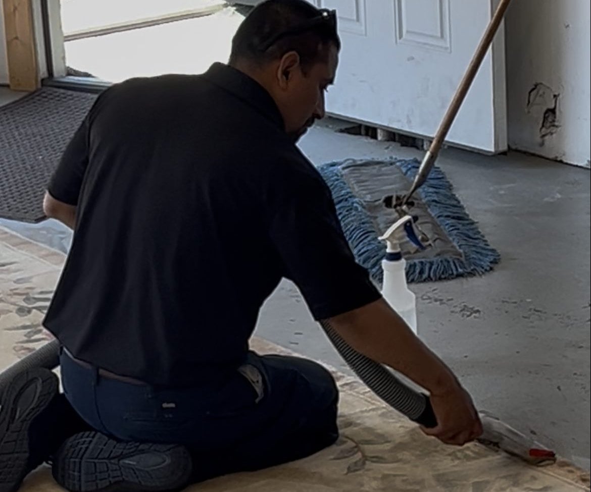 Technician cleaning an area rug in a Connecticut home