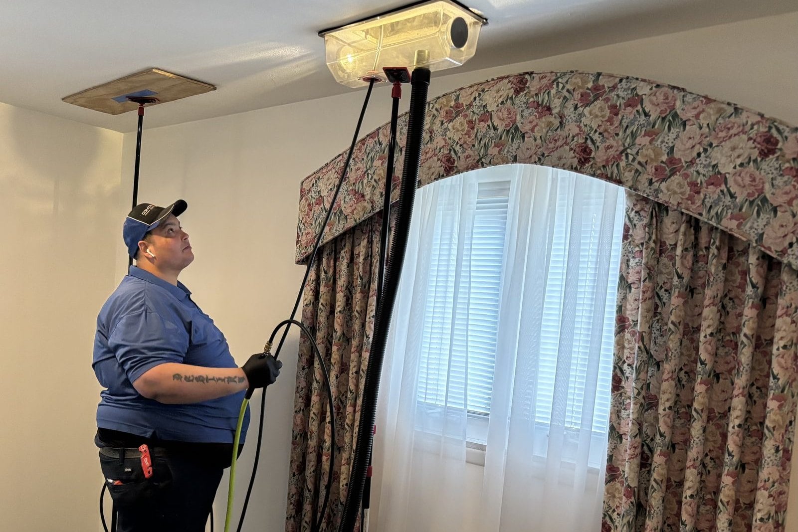 Professional Cleaning & Restoration Systems technician at work in a home