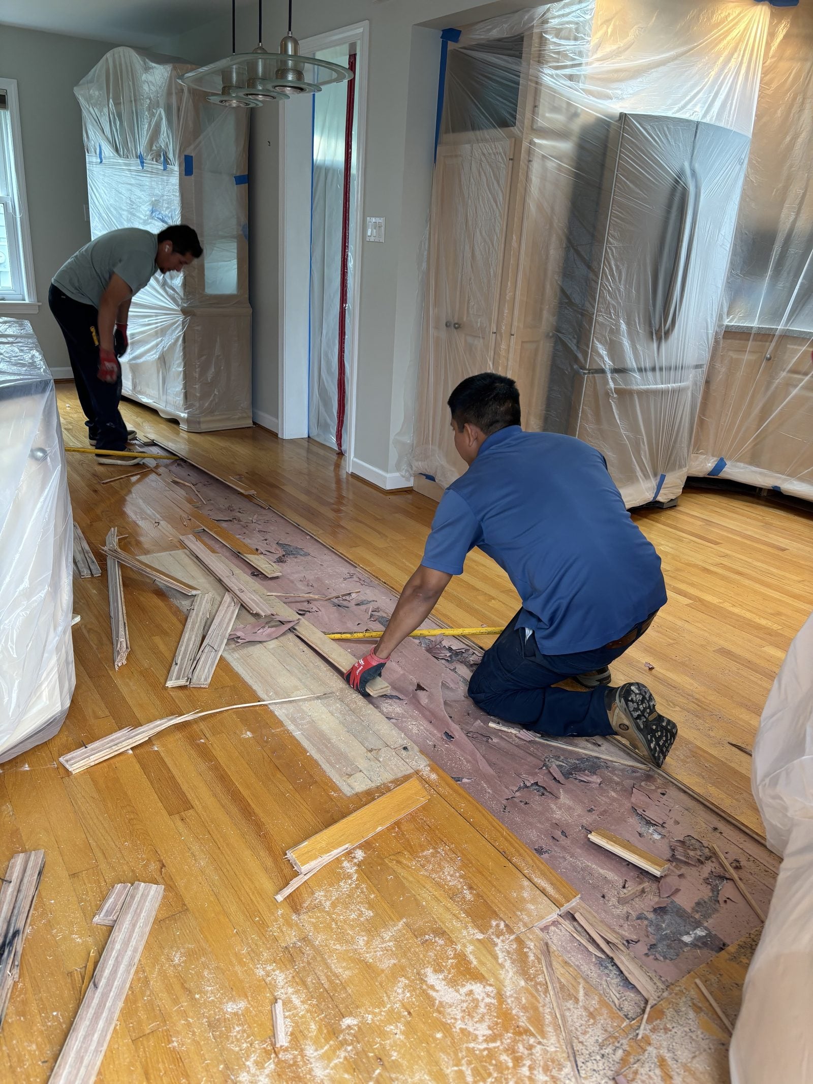 A PCRS technician removing water-damaged materials