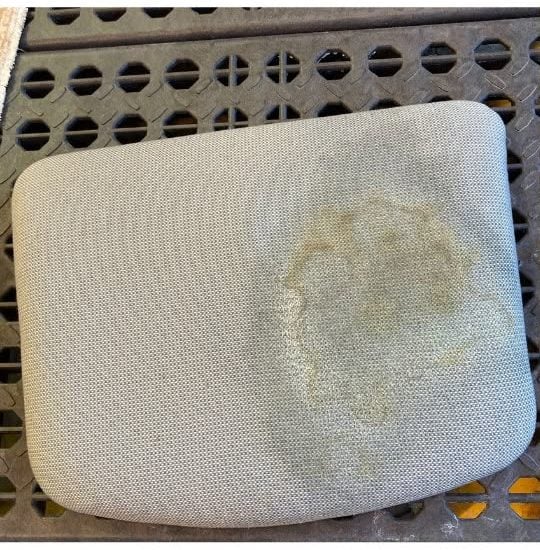 Outdoor patio cushion with a ring stain before professional upholstery cleaning, Shelton CT